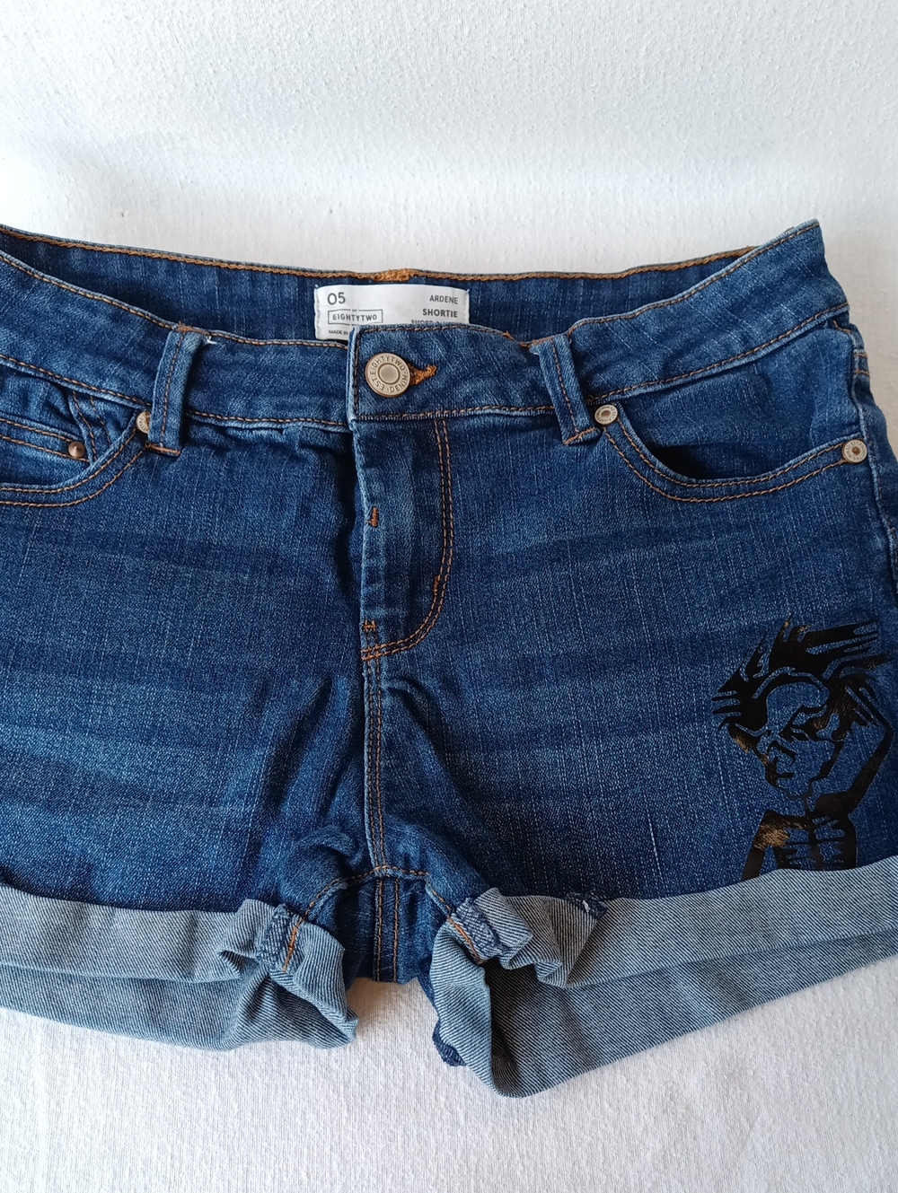 Dark Blue Cuffed Denim Short Shorts with Bold Graphics in Black